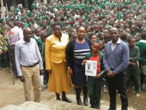 Brian Maina, the winner of the International drawing competition middle Left: Kirimi Mpungu, Administration Director, Oserian Flowers, In yellow - Mary Kinyua, Oserian Head of Human Resources Ruth Kingori, Headteacher, Oserian Primary